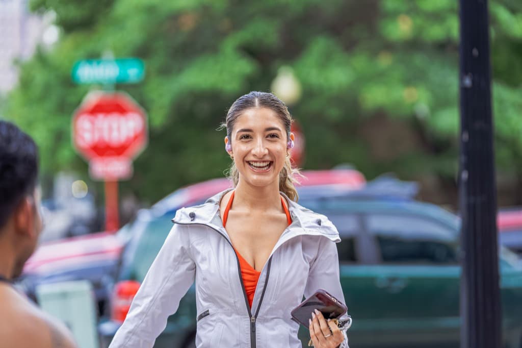 Woman smiling in gray jacket